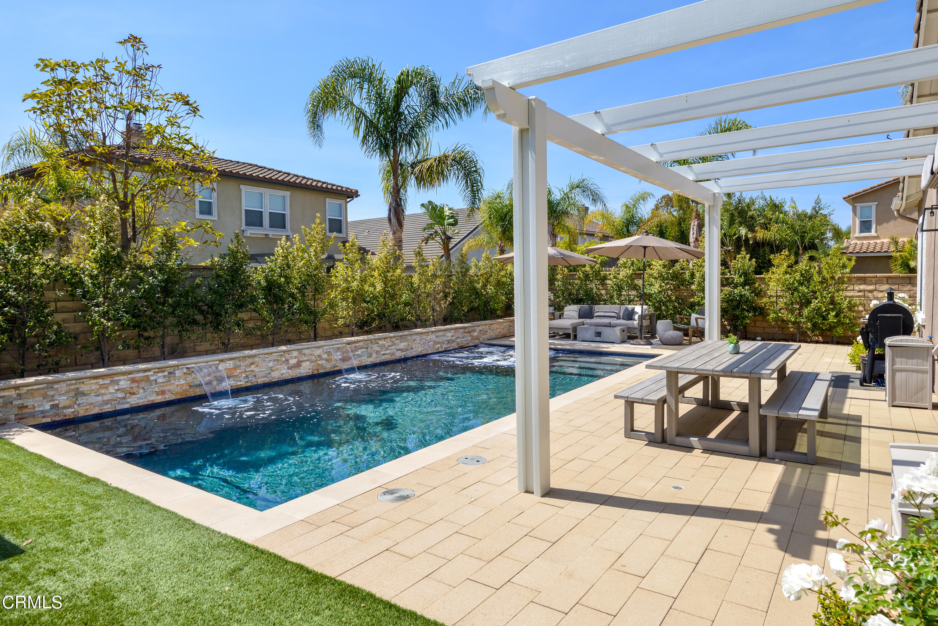 3064 White Rock Road Camarillo, CA 93012 - Photo 27 of 47 a view of a patio with plants and a table and chairs