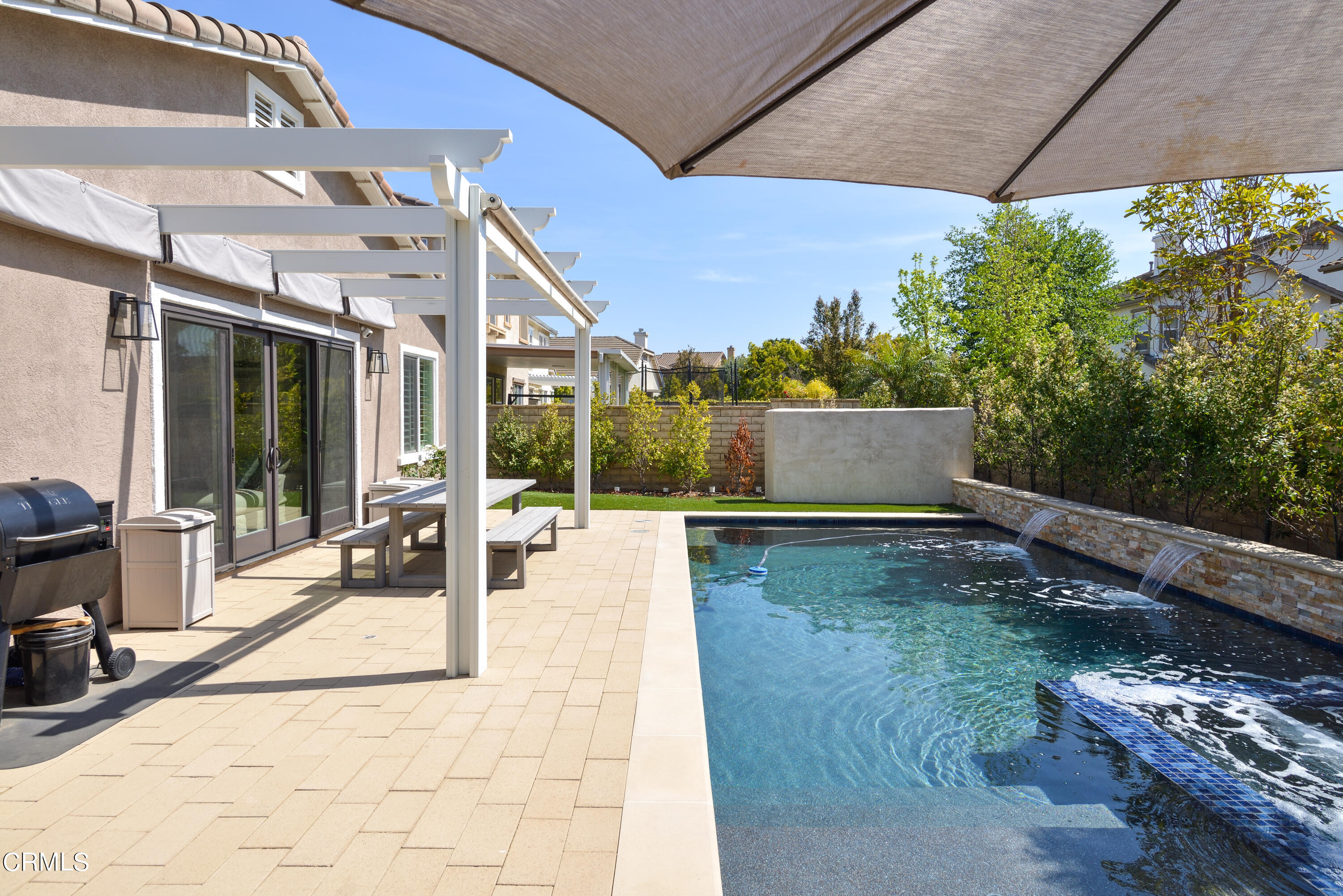 3064 White Rock Road Camarillo, CA 93012 - Photo 28 of 47 a view of a patio with table and chairs with wooden floor and fence