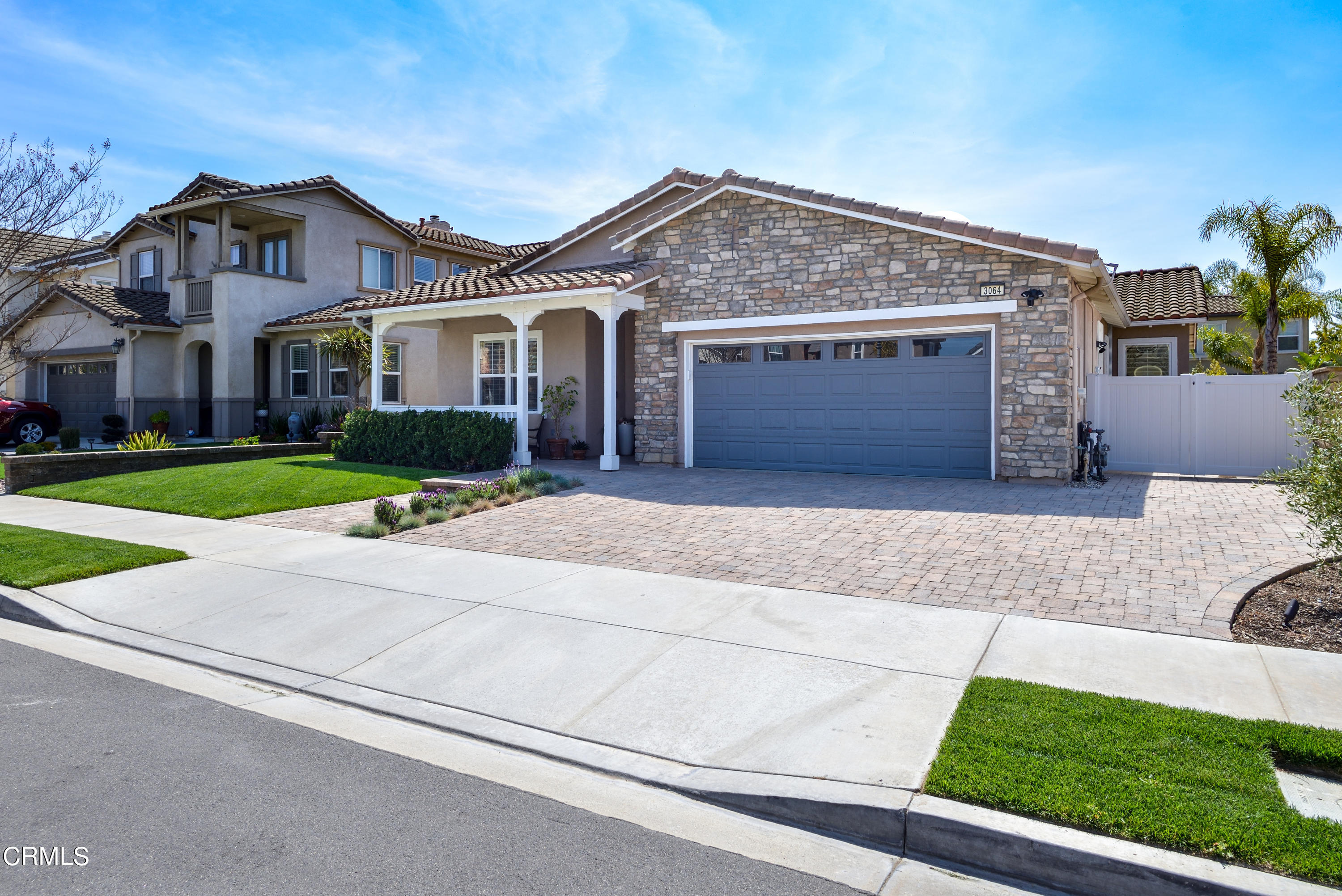 3064 White Rock Road Camarillo, CA 93012 - Photo 31 of 47 a front view of a house with a yard and garage