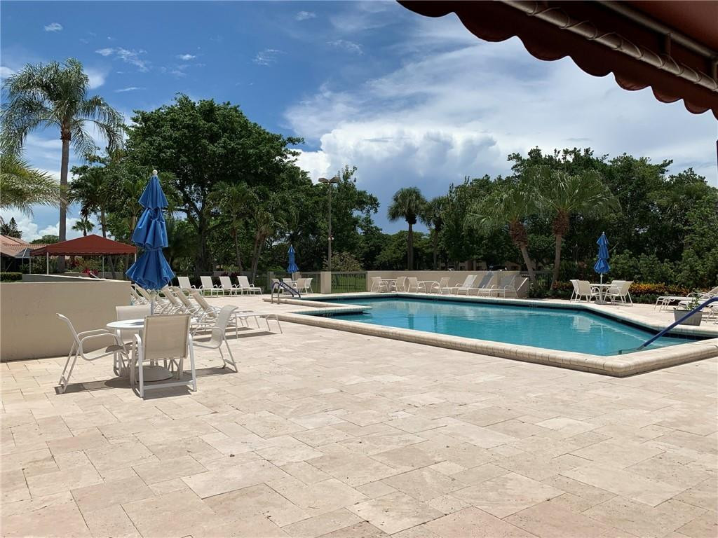 23336 Water Circle Boca Raton, FL 33486 - Photo 41 of 50 a view of a swimming pool with a patio