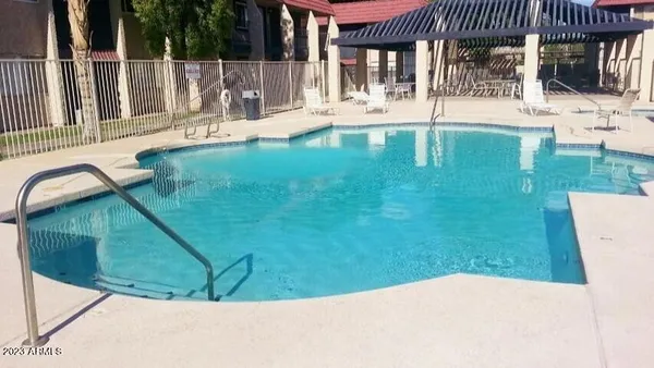 a view of a swimming pool with a patio