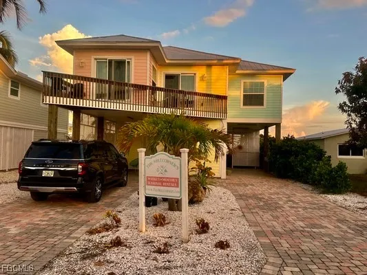 a view of a car park in front of house