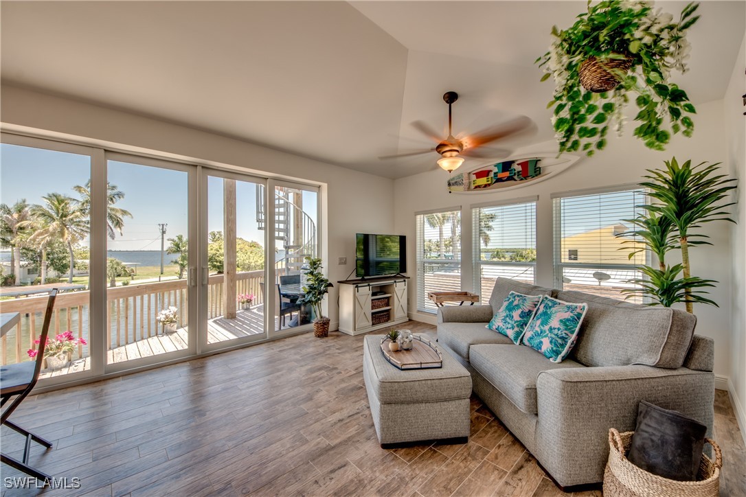 2579 Third Street Matlacha, FL 33993 - Photo 16 of 46 a living room with furniture fireplace and a large window