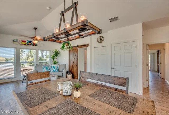 a living room with patio furniture and a window