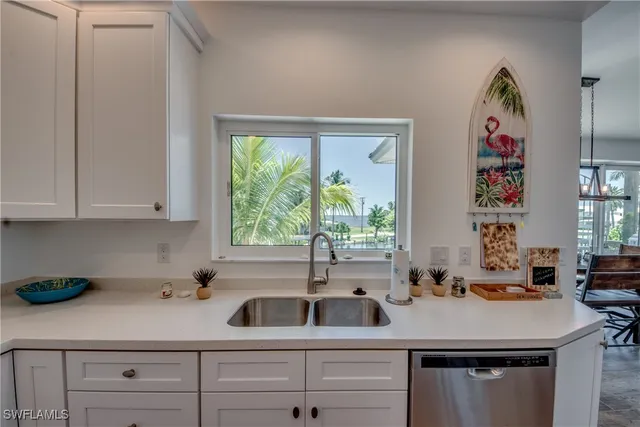 a kitchen with a sink and cabinets