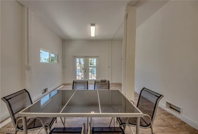 a view of a dining room with furniture and window