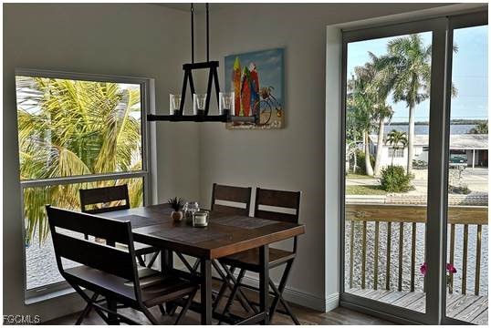 2579 Third Street Matlacha, FL 33993 - Photo 36 of 46 a view of a dining room with furniture window and outside view