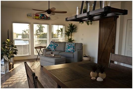 2579 Third Street Matlacha, FL 33993 - Photo 37 of 46 a living room with furniture and a floor to ceiling window