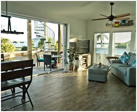 2579 Third Street Matlacha, FL 33993 - Photo 39 of 46 a living room with fireplace furniture and a floor to ceiling window