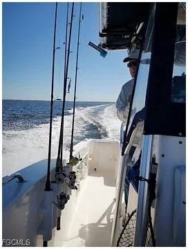 a view of swimming pool from a bathroom