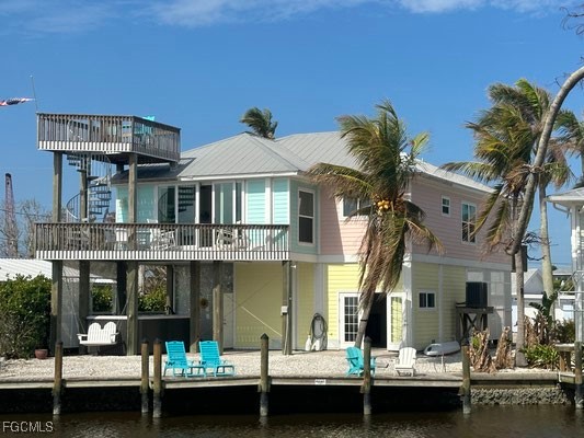 2579 Third Street Matlacha, FL 33993 - Photo 7 of 46 a front view of a house with swimming pool