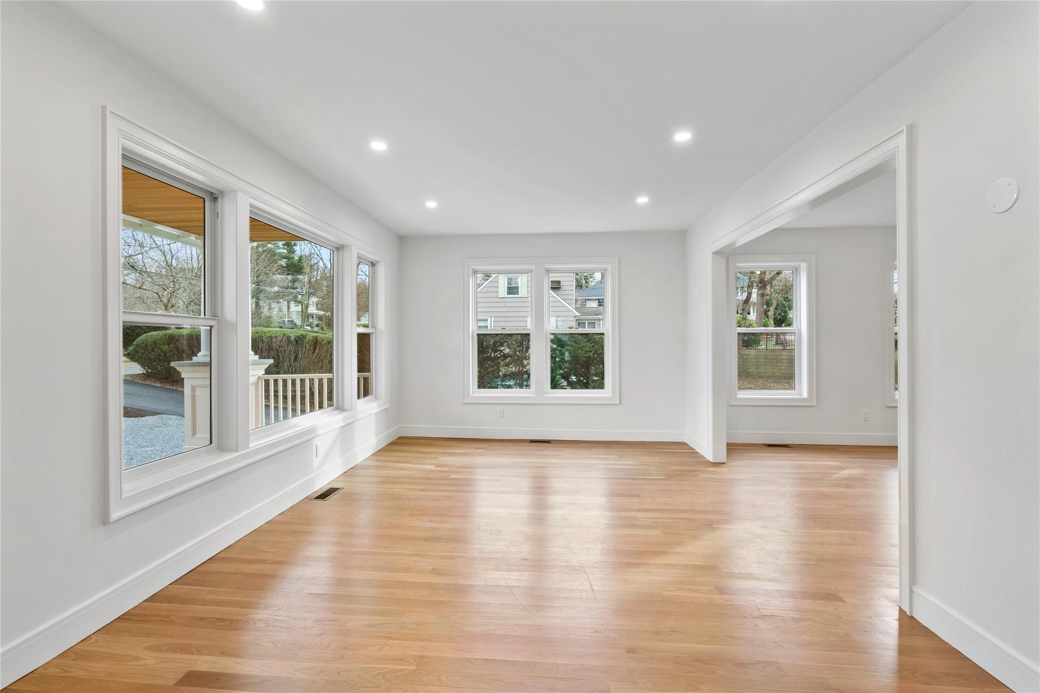 68 Glenlawn Avenue Sea Cliff, NY 11579 - Photo 11 of 49 a view of an empty room with wooden floor and a window
