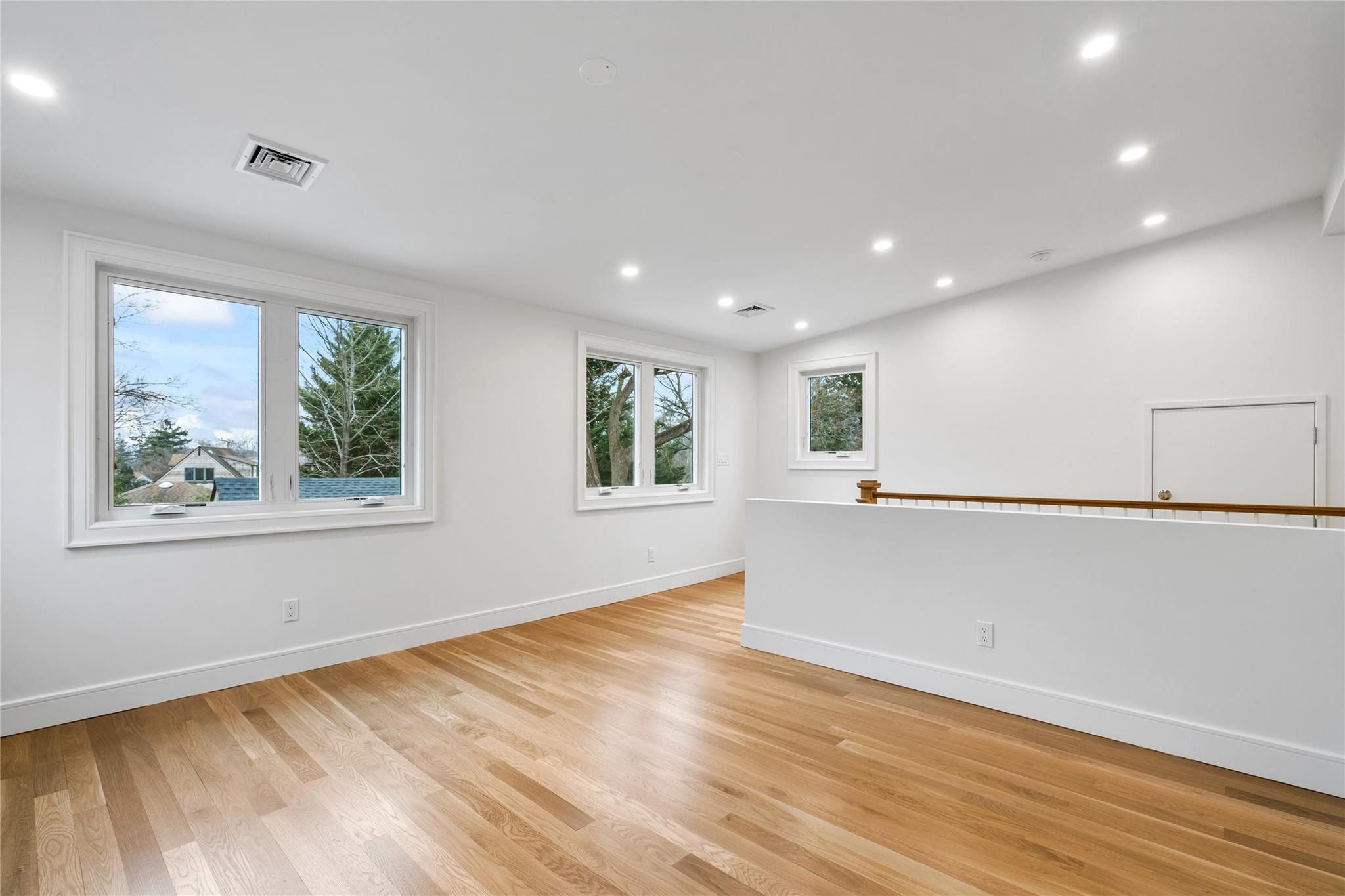 68 Glenlawn Avenue Sea Cliff, NY 11579 - Photo 21 of 49 a view of empty room with wooden floor and window