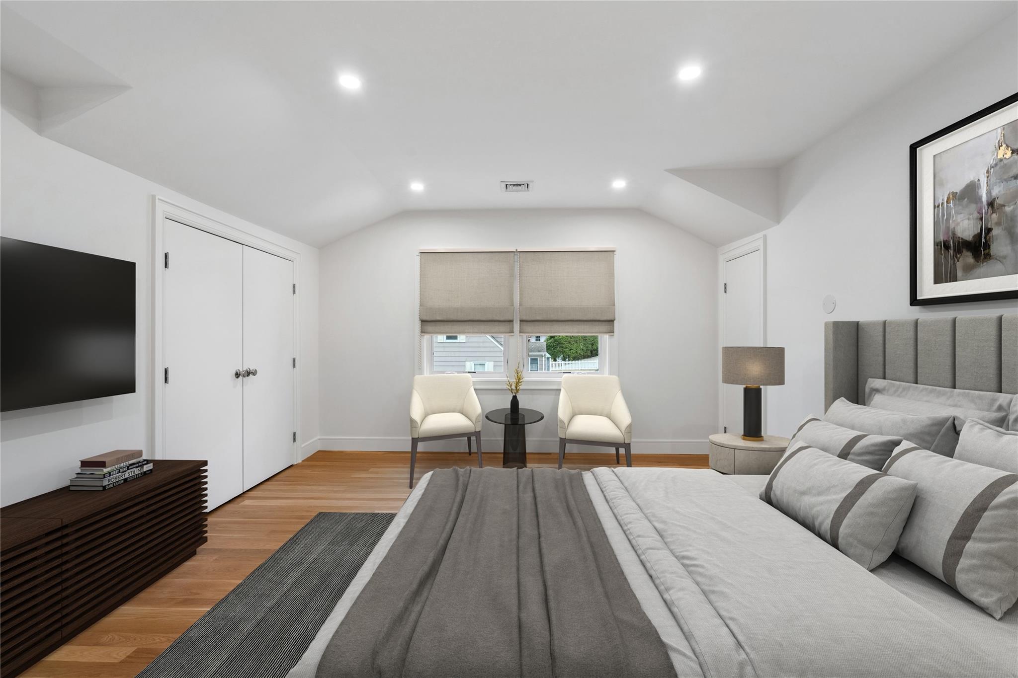 68 Glenlawn Avenue Sea Cliff, NY 11579 - Photo 24 of 49 a bed room with a bed and a flat screen tv