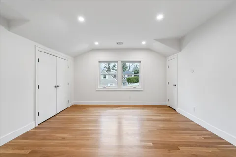 a bathroom with a sink shower and a mirror