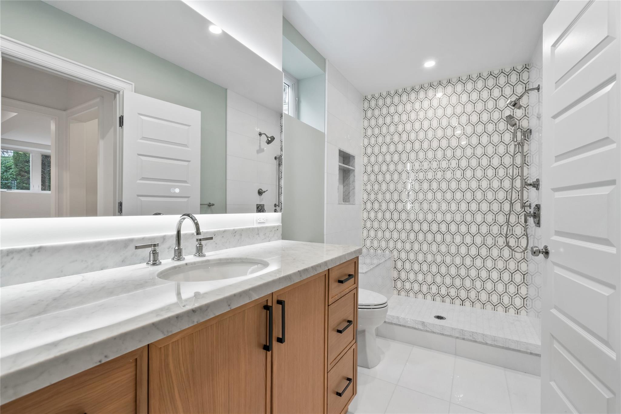 68 Glenlawn Avenue Sea Cliff, NY 11579 - Photo 31 of 49 a bathroom with a sink shower and a mirror