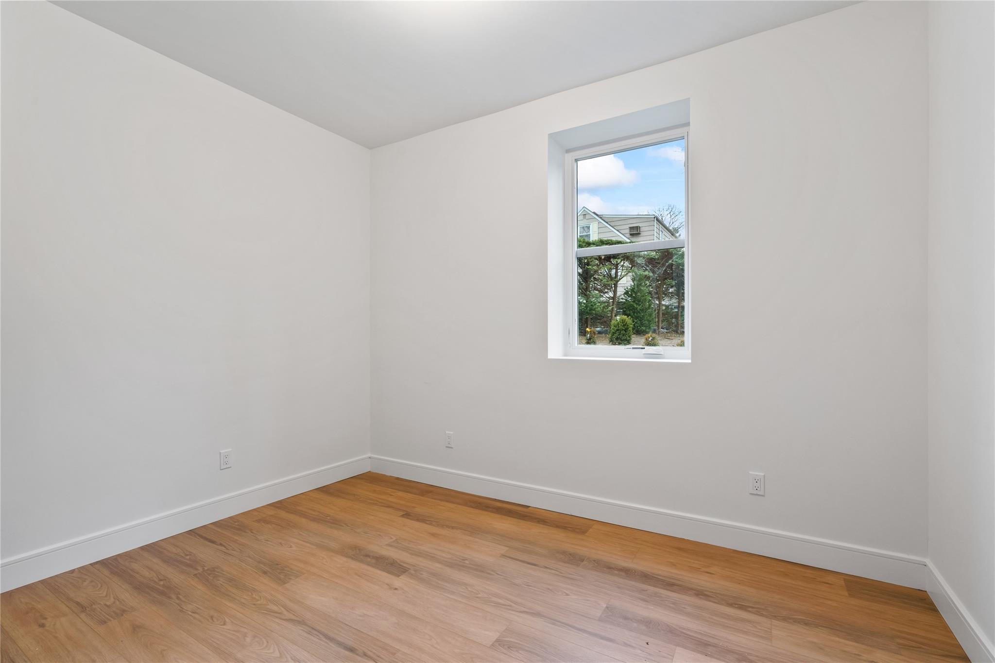 68 Glenlawn Avenue Sea Cliff, NY 11579 - Photo 33 of 49 One of two additional bedrooms on lower level