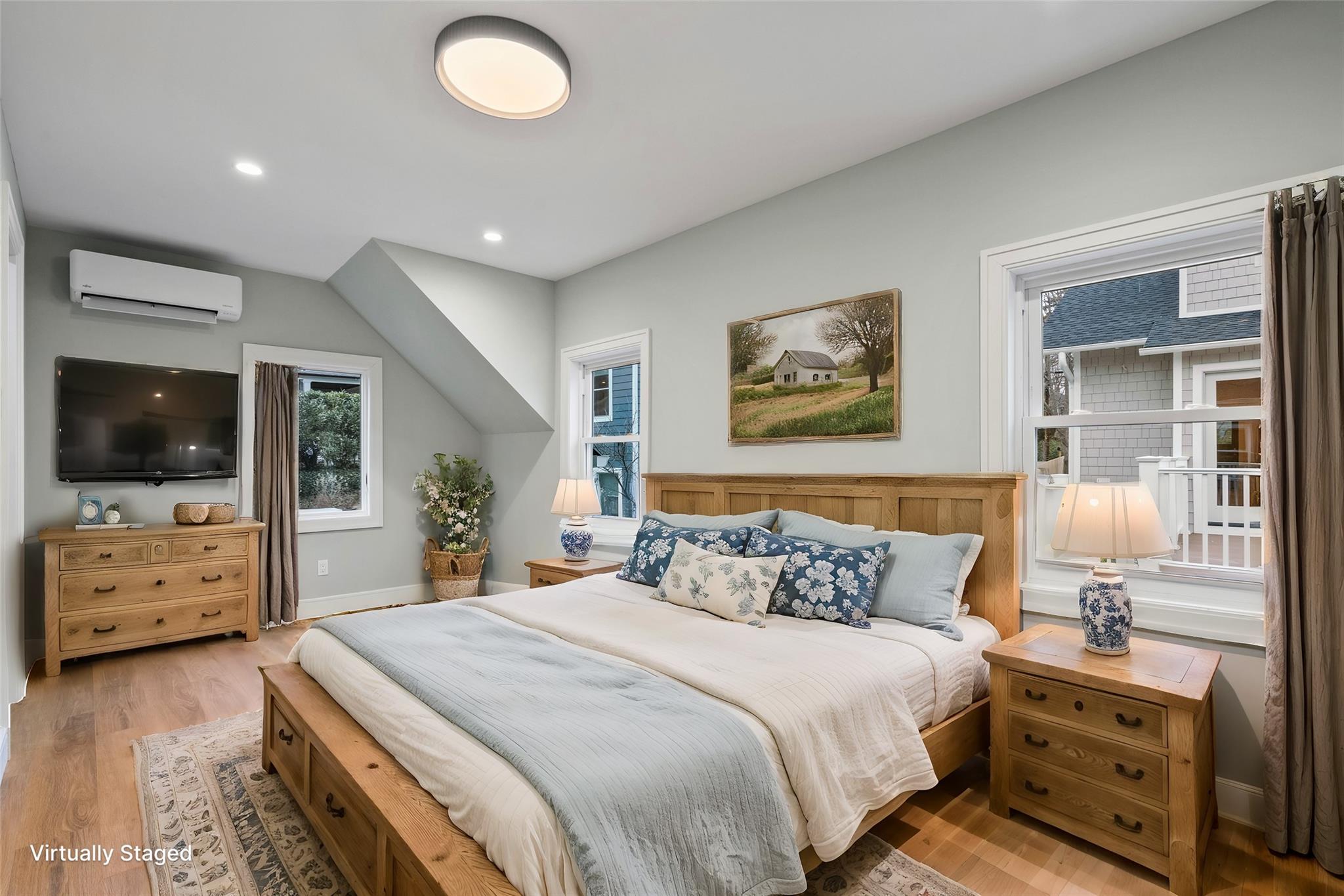 68 Glenlawn Avenue Sea Cliff, NY 11579 - Photo 39 of 49 a bedroom with a bed and a flat screen tv