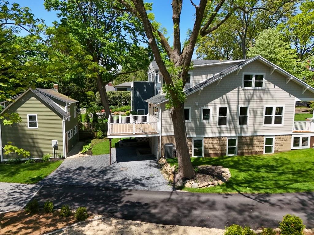 68 Glenlawn Avenue Sea Cliff, NY 11579 - Photo 6 of 49 Rear view of house with driveway, a deck, a yard, and a carport