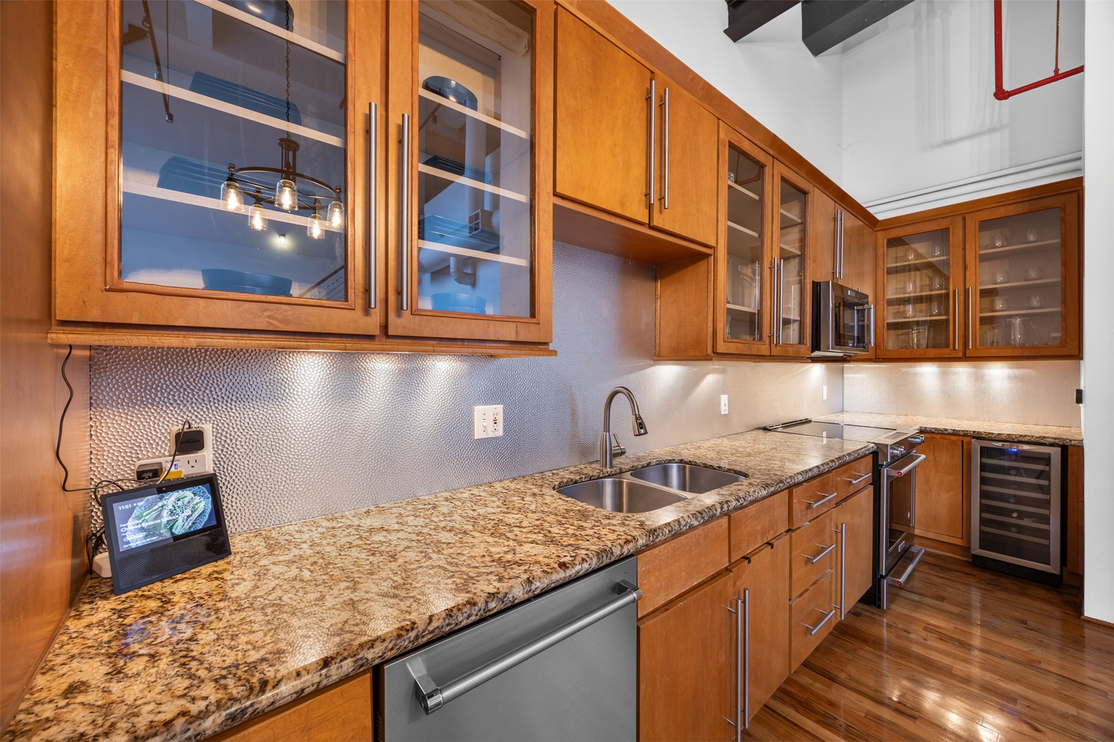 705 Main Street, Unit 513 Houston, TX 77002 - Photo 8 of 22 a kitchen with stainless steel appliances granite countertop a sink stove and cabinets