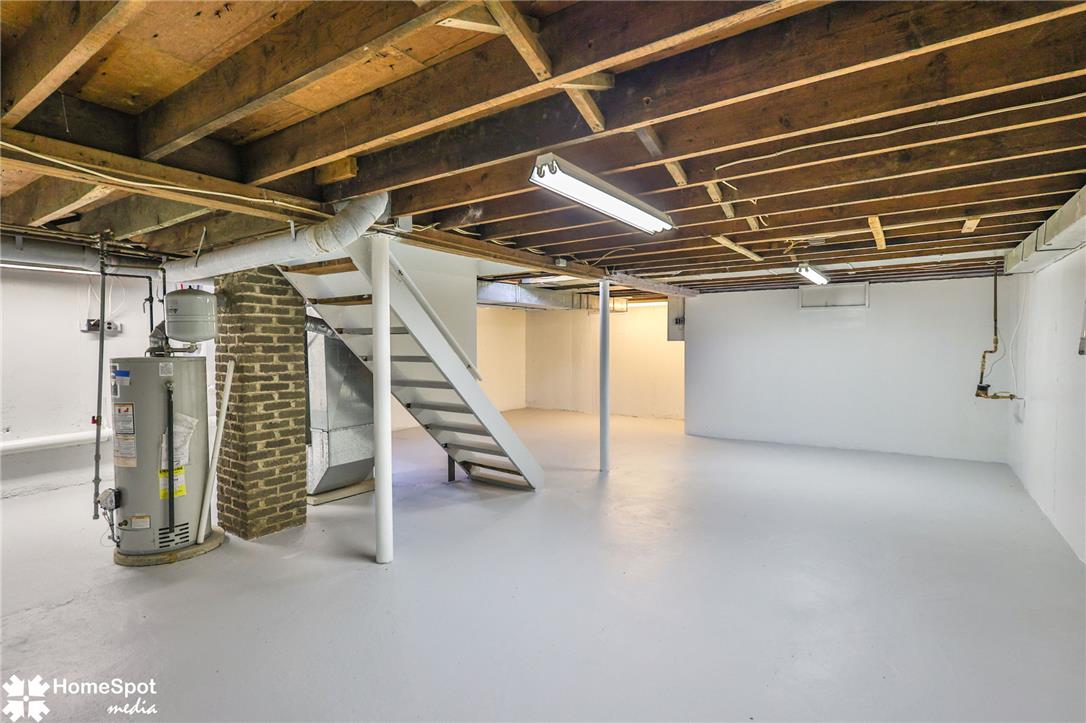 415 Willow Road Hellertown, PA 18055 - Photo 22 of 25 A spacious, unfinished basement awaits your personal touch, offering abundant storage or future expansion.