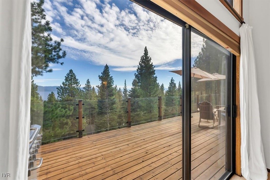 553 Silvertip Drive Incline Village, NV 89451 - Photo 15 of 35 a view of a balcony with wooden floor and iron stairs