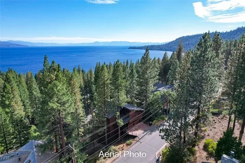 an aerial view of a house with mountain view