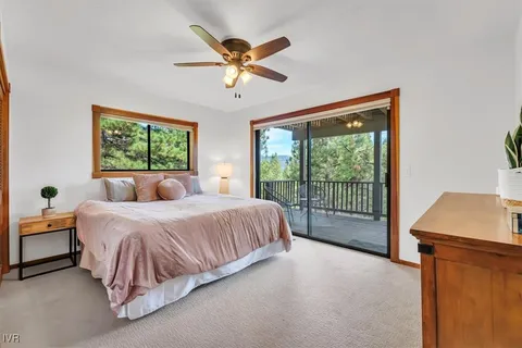 a spacious bedroom with a bed and a window