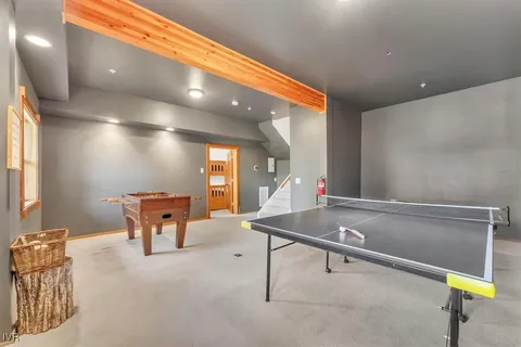 a dining room with furniture and a potted plant
