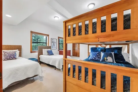 a bedroom with furniture and a window