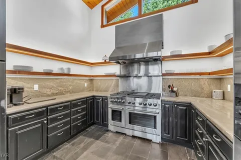 a kitchen with a stove and a sink