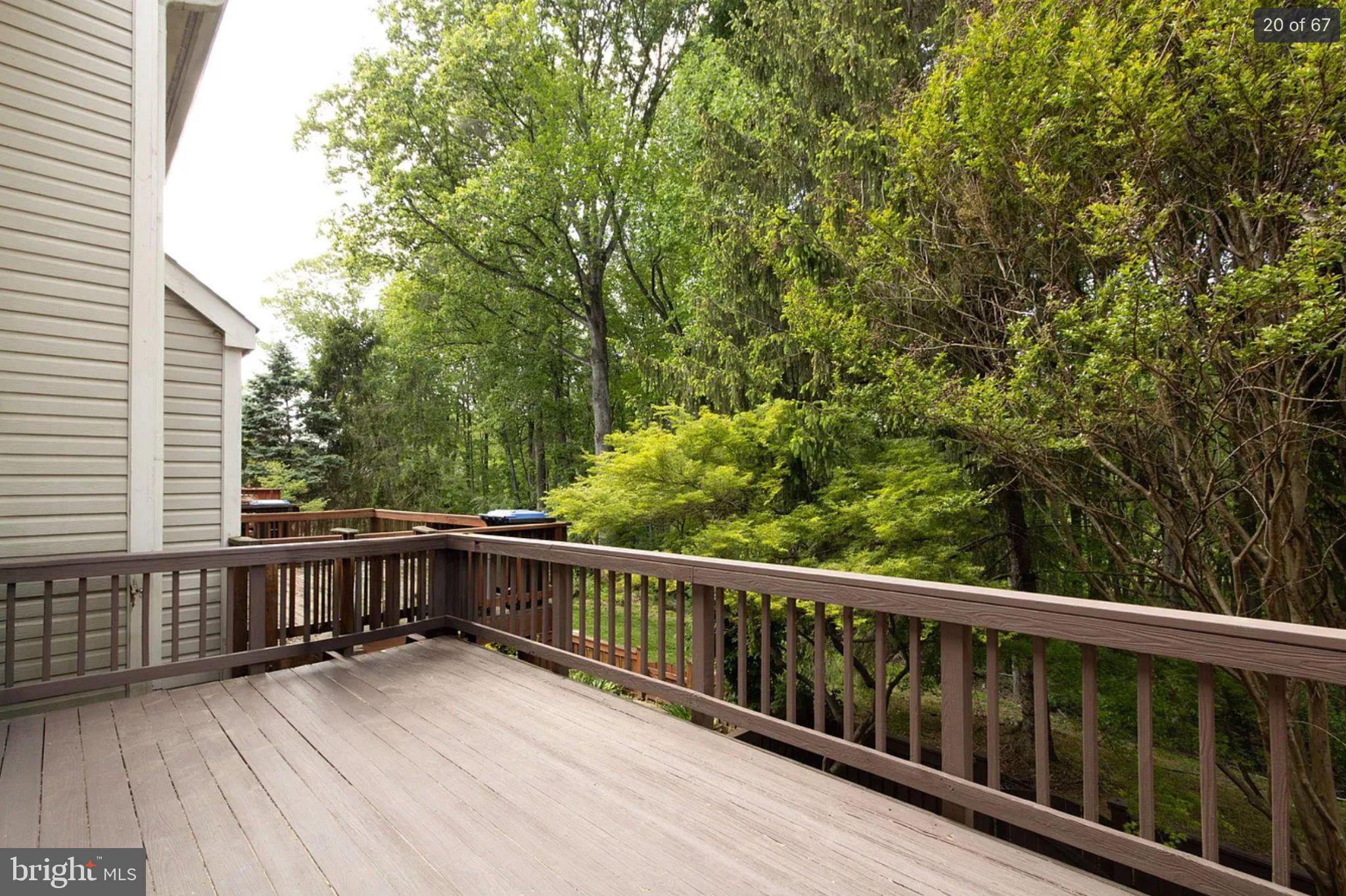 3906 Valley Ridge Drive Fairfax, VA 22033 - Photo 20 of 58 Serene deck surrounded by lush greenery.