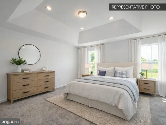 a bathroom with a double vanity sink and mirror