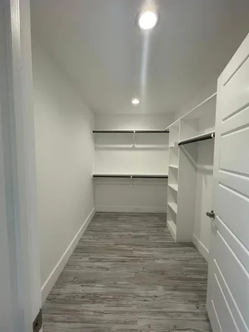 a room view with wooden floor and staircase