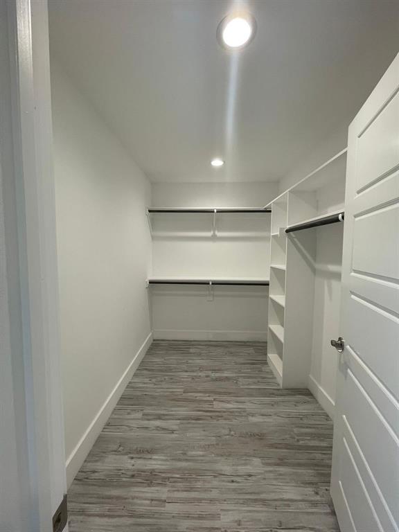 1315 West Gandy Street Denison, TX 75020 - Photo 13 of 19 a room view with wooden floor and staircase