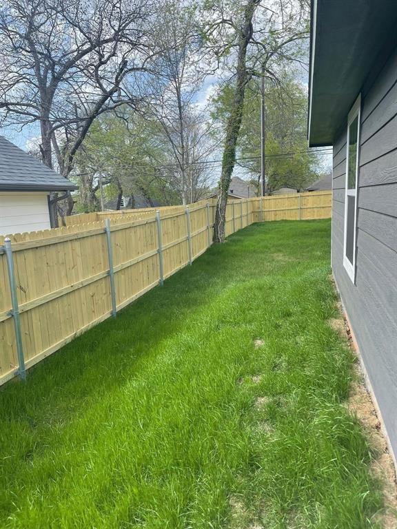 1315 West Gandy Street Denison, TX 75020 - Photo 19 of 19 a view of backyard with trees