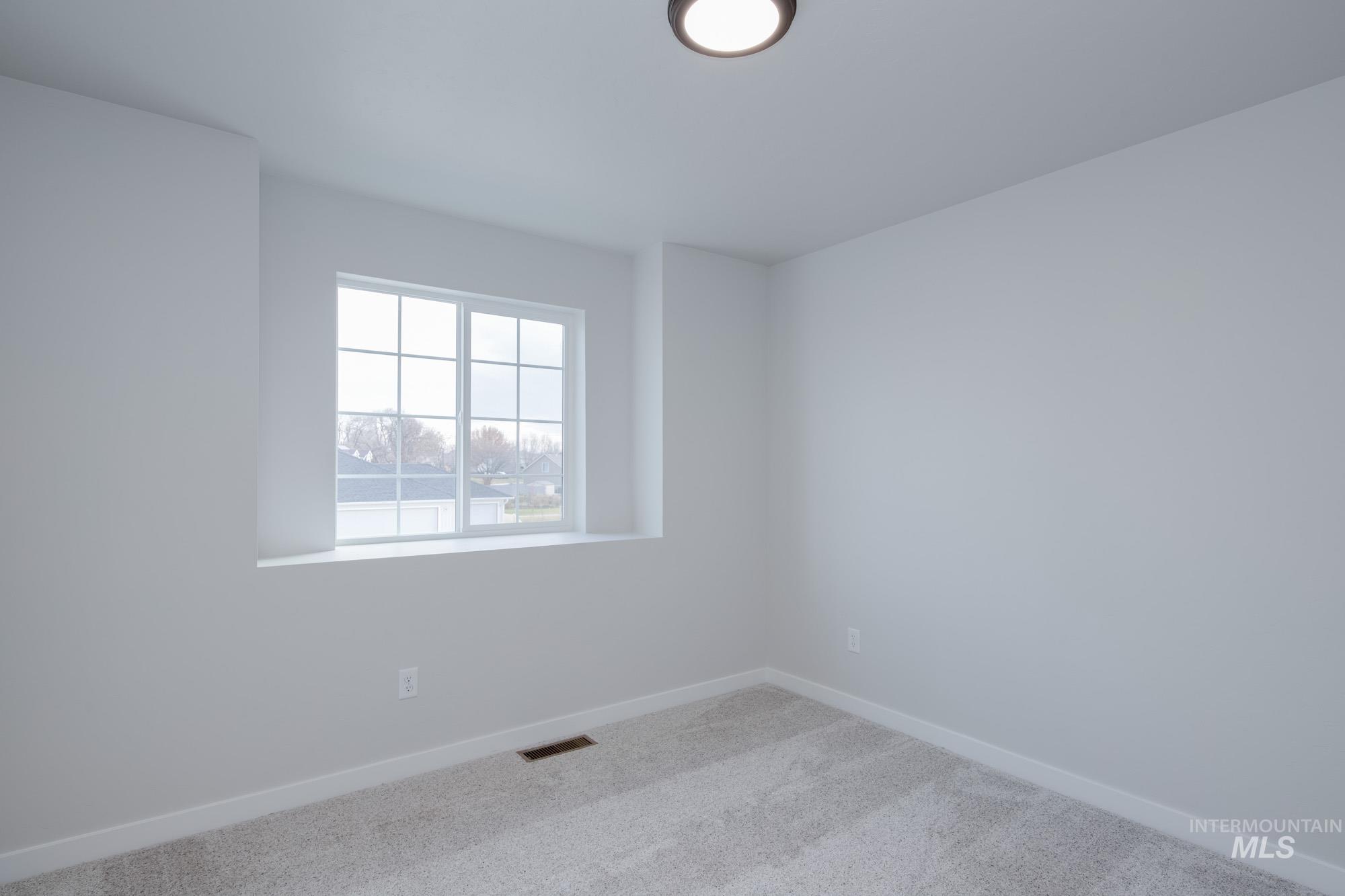 3089 South Maple Rnch Way Nampa, ID 83686 - Photo 18 of 22 Carpeted empty room featuring baseboards