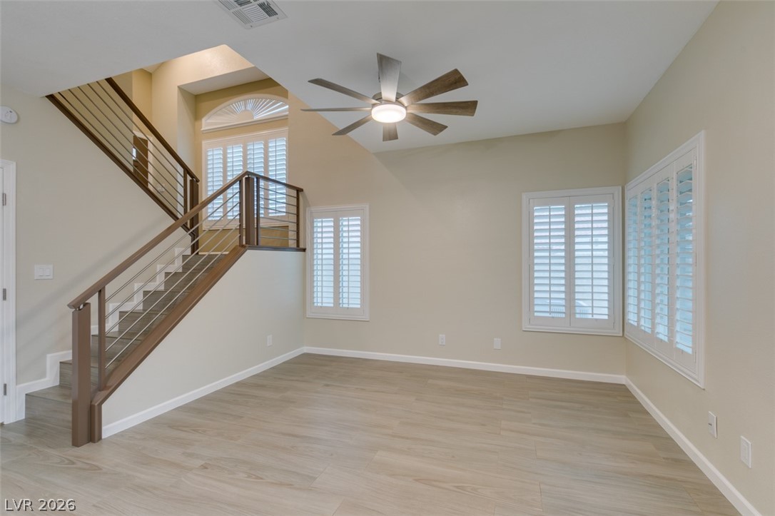 540 Sutters Mill Road Henderson, NV 89014 - Photo 2 of 46 Bright interior living space with high ceilings and wood flooring.