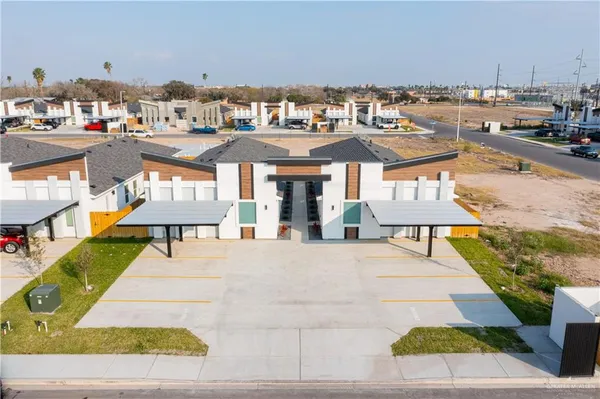 a aerial view of a house with a yard