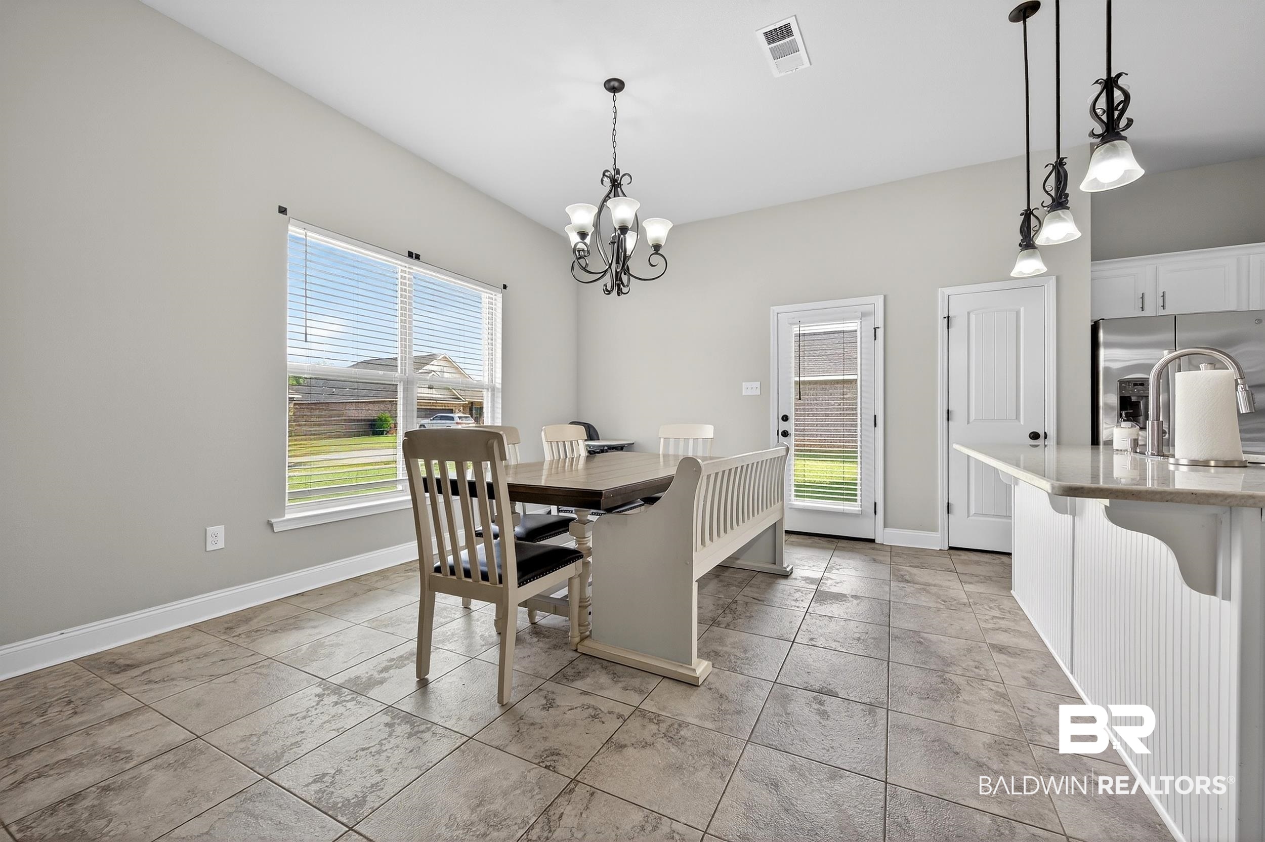 1084 Stella Road Foley, AL 36535 - Photo 8 of 31 Dining area with baseboards and suspended lighting