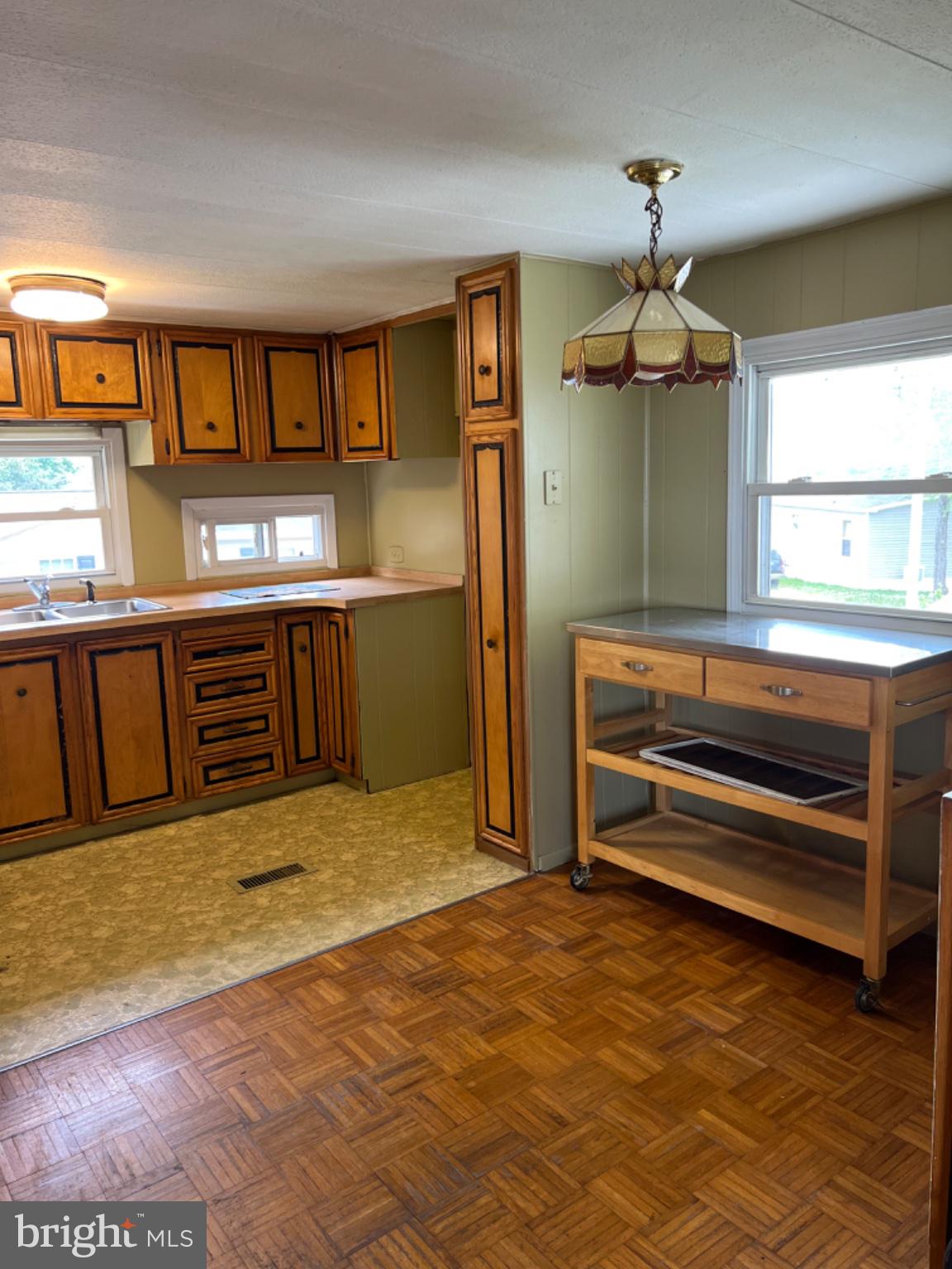 1302 Gibson Road, Unit 152 Bensalem, PA 19020 - Photo 3 of 18 a view of kitchen with granite countertop cabinets and refrigerator