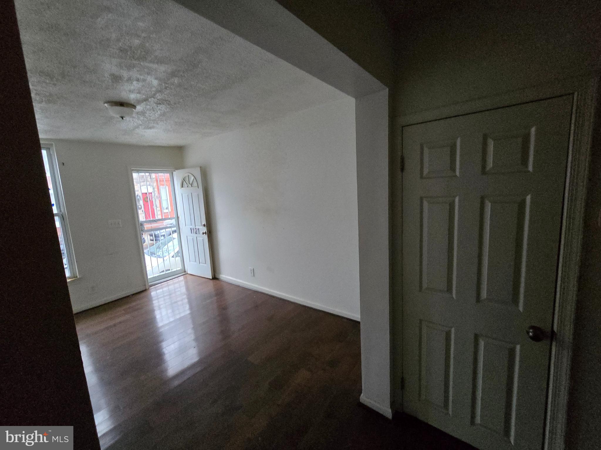 1121 Cleveland Street Baltimore, MD 21230 - Photo 3 of 13 wooden floor in an empty room