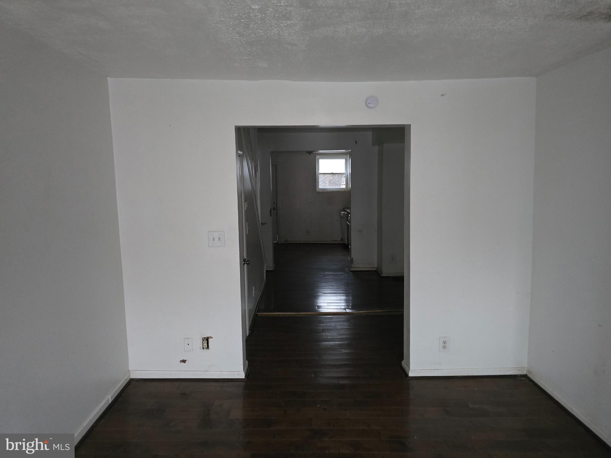 1121 Cleveland Street Baltimore, MD 21230 - Photo 10 of 13 an empty room with wooden floor and closet