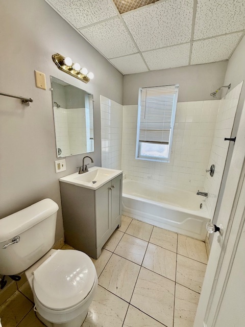 9213 South Laflin Street, Unit 3A Chicago, IL 60620 - Photo 5 of 8 a bathroom with a sink toilet and shower