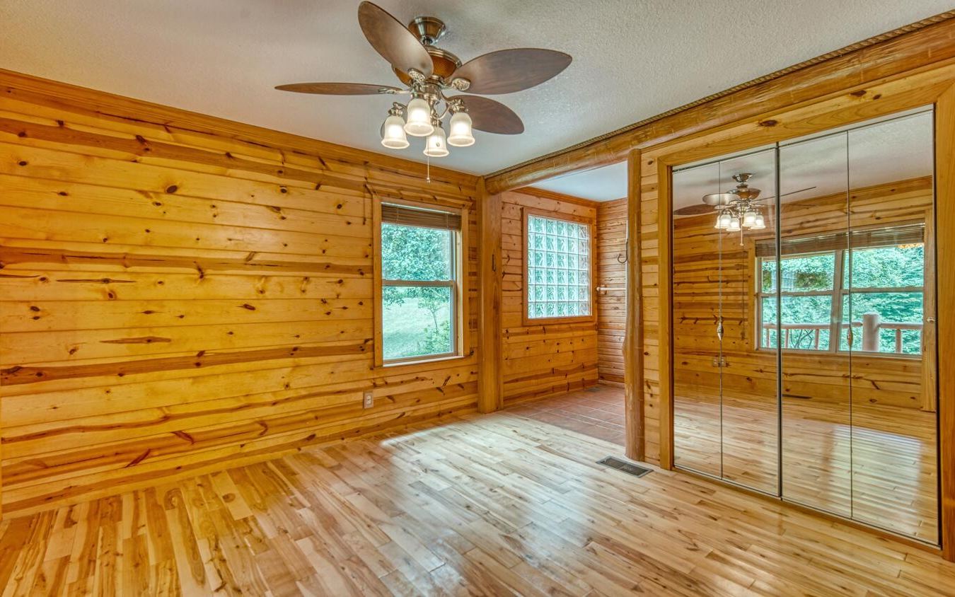 1666 Underwood Road Hiawassee, GA 30546 - Photo 12 of 42 wooden floor in an empty room with a window