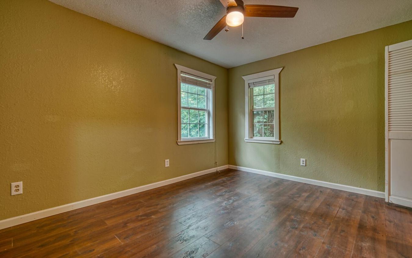 1666 Underwood Road Hiawassee, GA 30546 - Photo 20 of 42 a view of an empty room with wooden floor and a window
