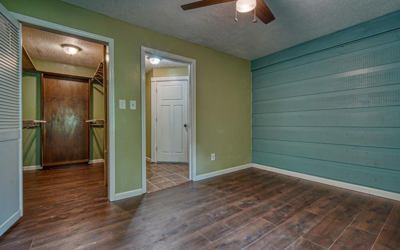 1666 Underwood Road Hiawassee, GA 30546 - Photo 21 of 42 an empty room with closet and a chandelier fan