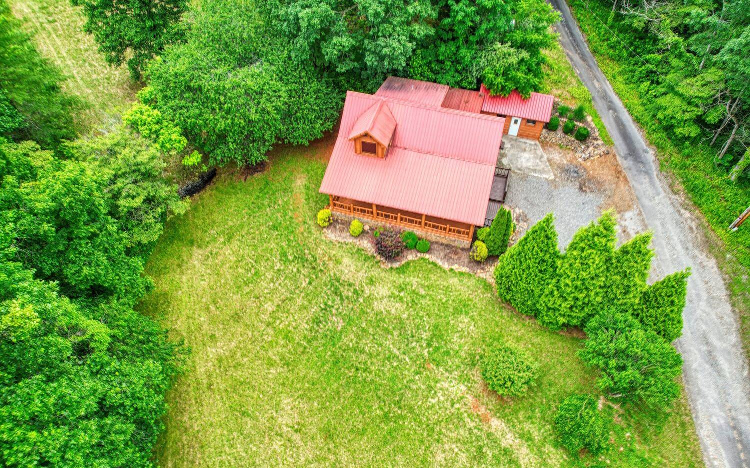 1666 Underwood Road Hiawassee, GA 30546 - Photo 41 of 42 an aerial view of a house with a yard and trees all around