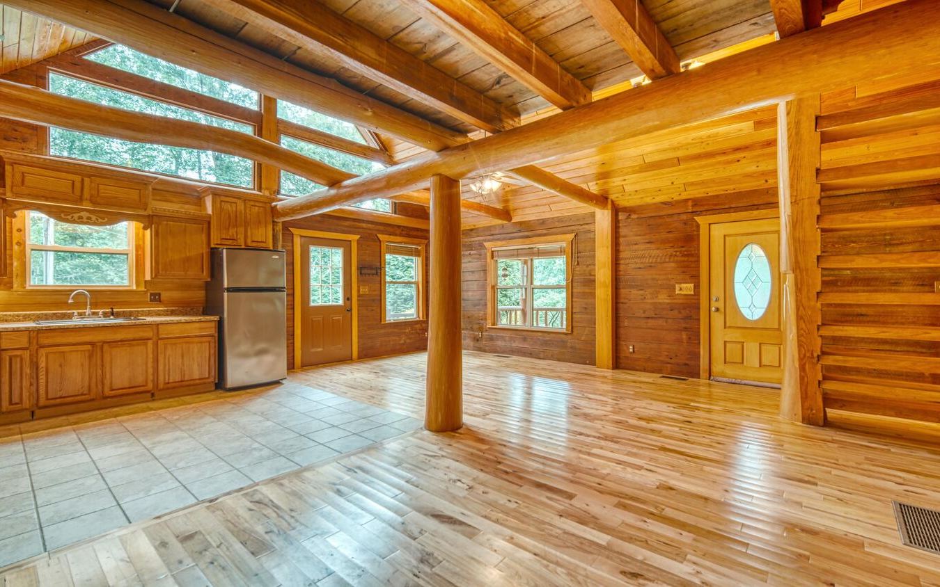 1666 Underwood Road Hiawassee, GA 30546 - Photo 8 of 42 a view of an empty room with window and wooden floor