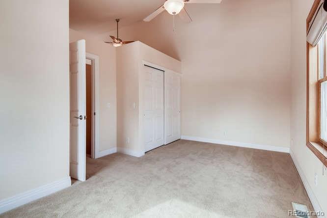 380 County Road Louisville, CO 80027 - Photo 15 of 28 an empty room with a window and a ceiling fan